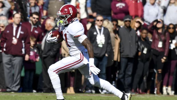 Nov 16, 2019; Starkville, MS, USA; Alabama Crimson Tide wide receiver Henry Ruggs III (11) runs the ball against the Mississippi State Bulldogs during the first quarter at Davis Wade Stadium. Mandatory Credit: Matt Bush-USA TODAY Sports